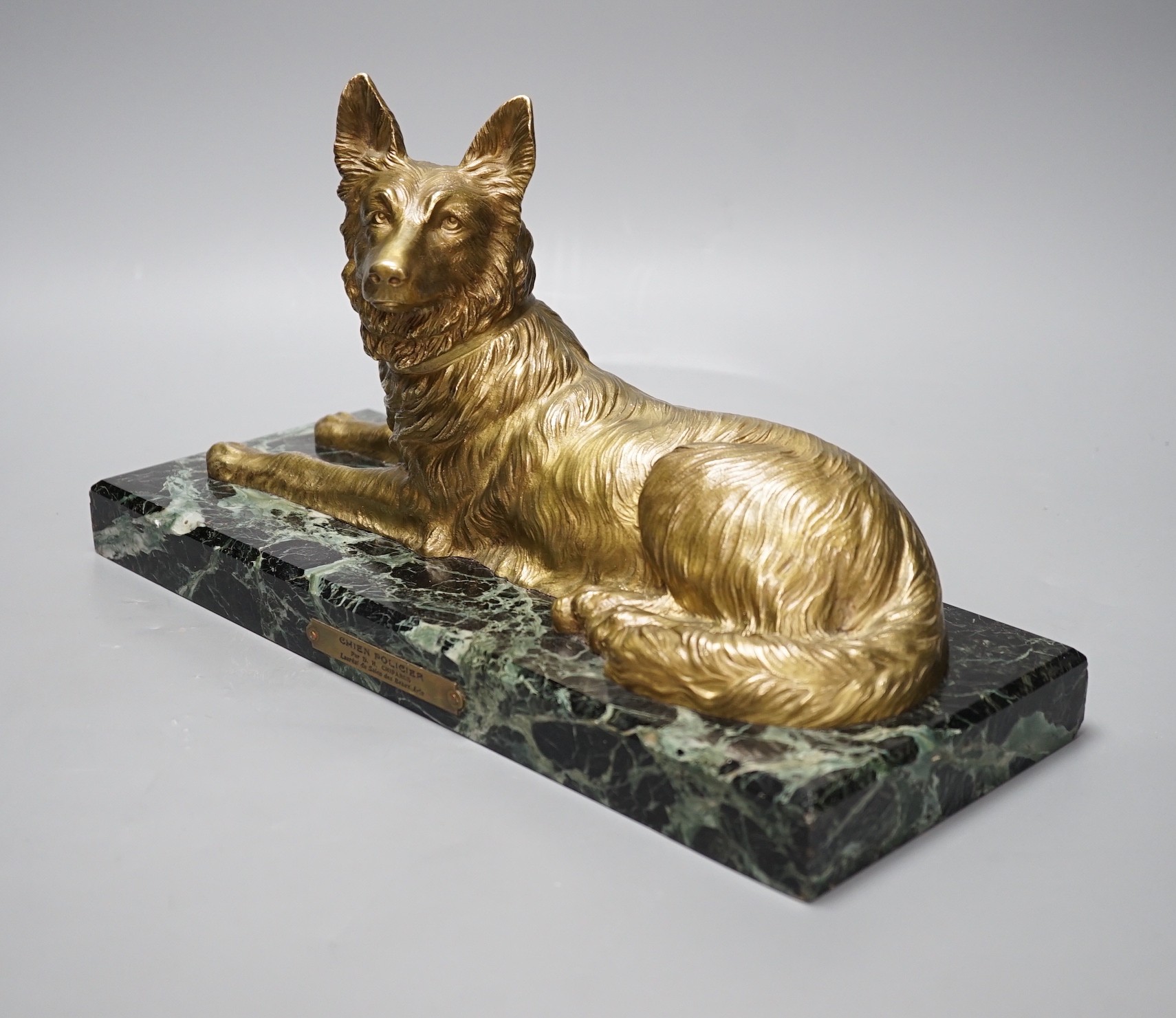 After D H Chiparus, a gilt metal figure of a German Shepherd dog, on marble base, 36 cms wide